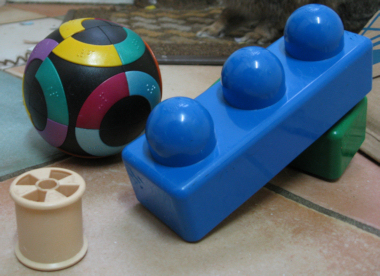 Left to right: Cotton reel, puzzel ball, blocks.